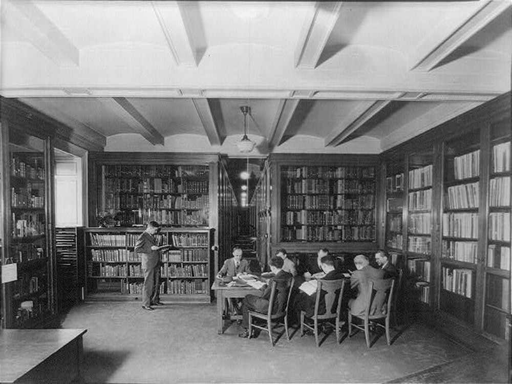 Men reading in a book-lined room at the Library of Congress, c. 1920. The Library of Congress, Prints and Photographs.