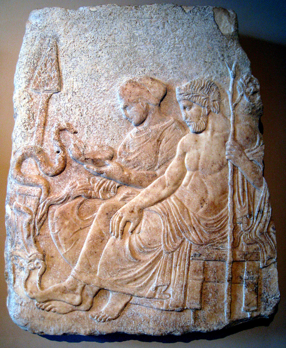 Marble relief of Asclepius, the god of medicine, and his daughter Hygieia, the goddess of cleanliness, c. 400 BC. The cult of Asclepius rose in prominence after the Athenian plague. Photograph by Prioryman. Wikimedia Commons, Istanbul Archaeological Museums.