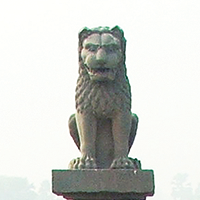 Stone statue of a lion atop a pillar