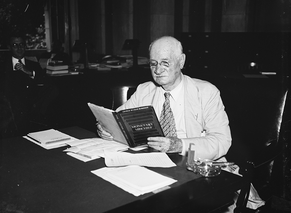 Photograph of Senator Duncan Fletcher, chair of the Senate Banking Committee, looking over a copy of Monetary Mischief, 1935. Photograph by Harris & Ewing. Library of Congress, Prints and Photograph Division.