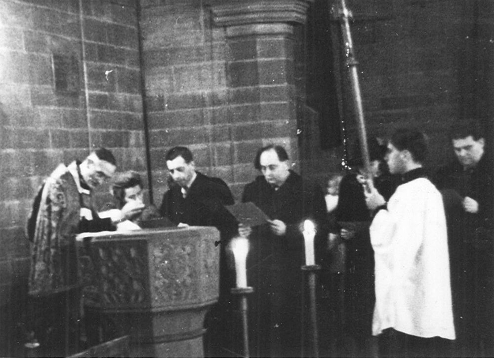 The author's christening in Liverpool, 1944. H. P. Smolka, then known as H. P. Smollett, is in the center.