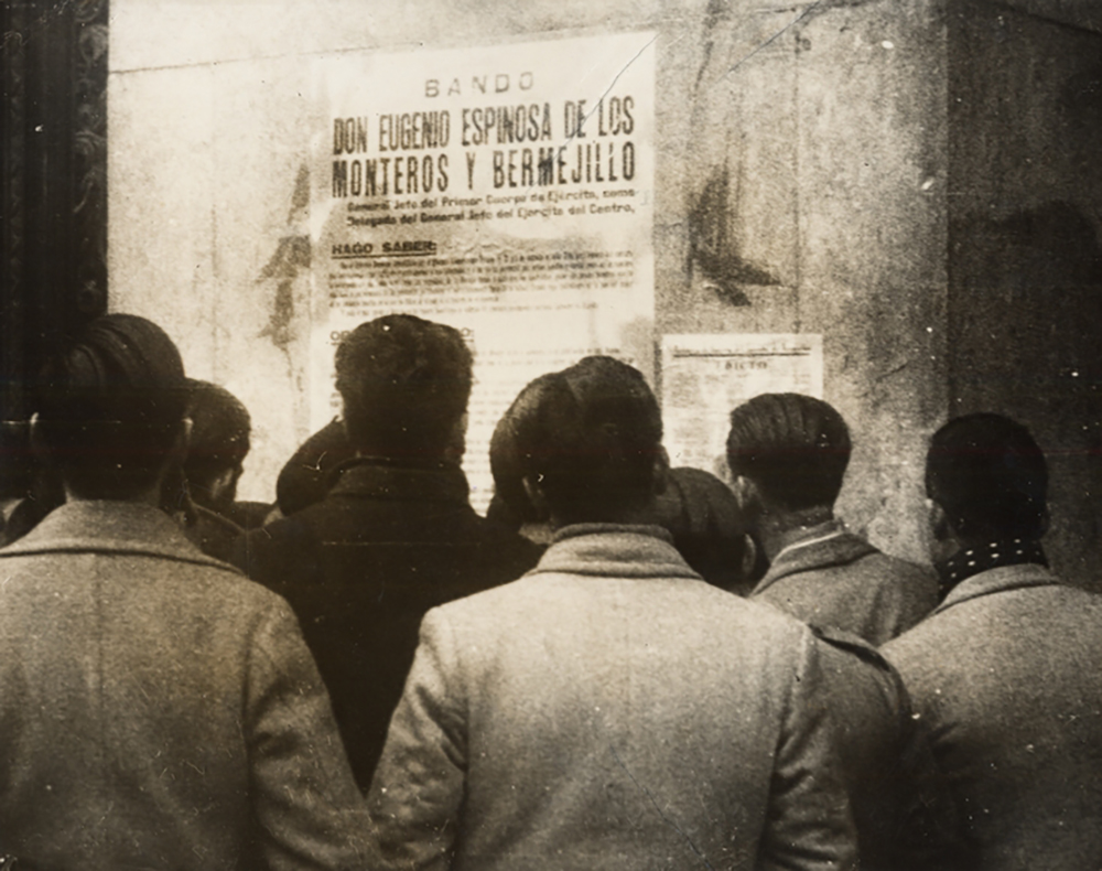 Residents of Madrid reading a Nationalist proclamation put up by General Franco’s staff following the end of the Spanish Civil War, 1939. UC San Diego, Special Collections and Archives.