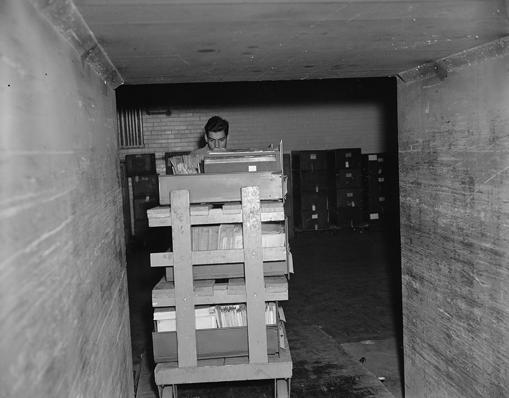 This chamber is used to fumigate the documents. A gas is used to kill any kind of insect life that may be living between the pages of the documents. The gas is left on for about three hours.