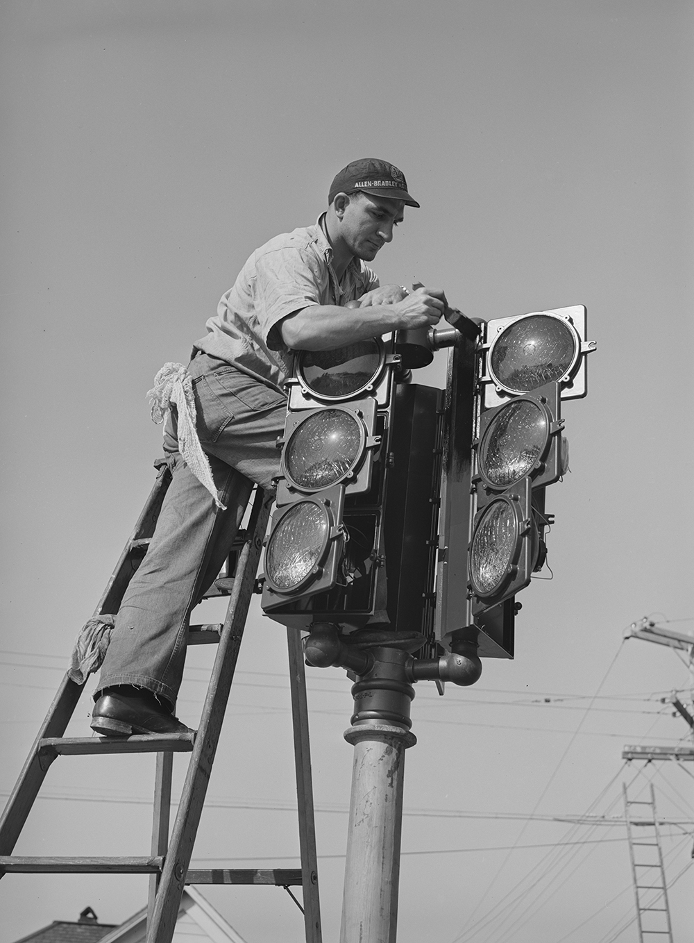 Putting up a new traffic signal in San Diego, California, 1940. Photograph by Russell Lee. Library of Congress, Prints and Photographs Division.