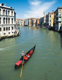 A photograph of a gondola on a Venice canal.