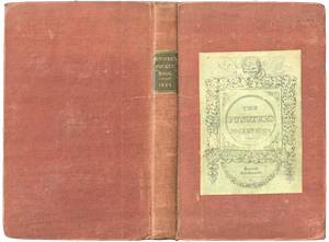 A book with a plain red cloth binding. A leather label on the spine and a paper label on the front give the title of the book.