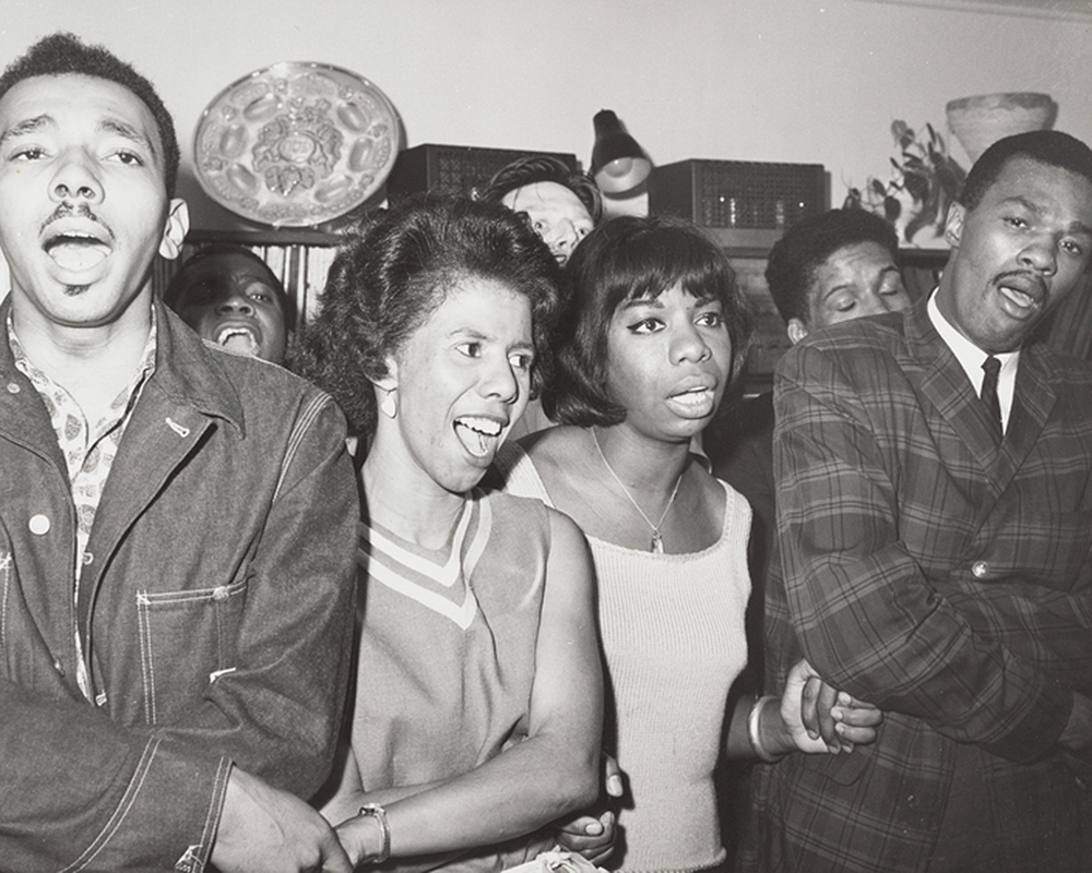 Singing in small group with Lorraine Hansberry and Nina Simone, 1963. The New York Public Library, Ivan Black papers.