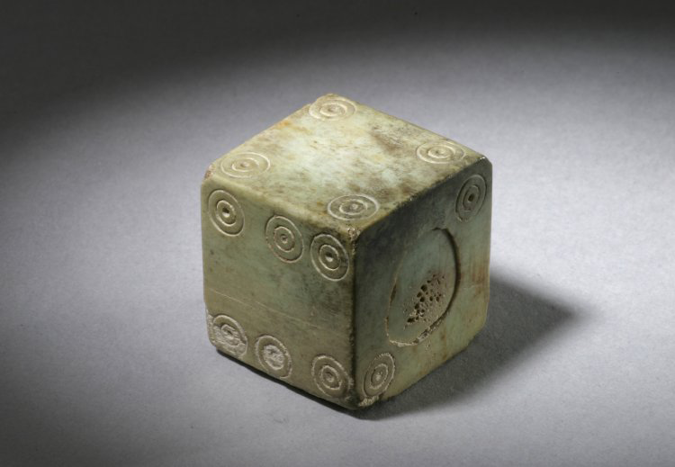 Dice made of bone, with numbers arranged differently from modern dice, classical world. © The Trustees of the British Museum.