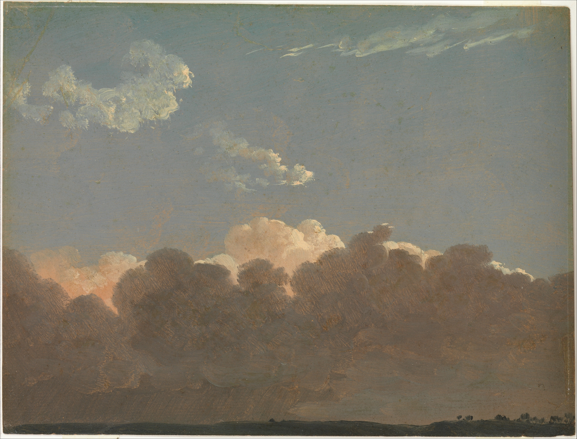 Dark clouds rising up from the shadowed ground, lightening up toward the bright blue sky.