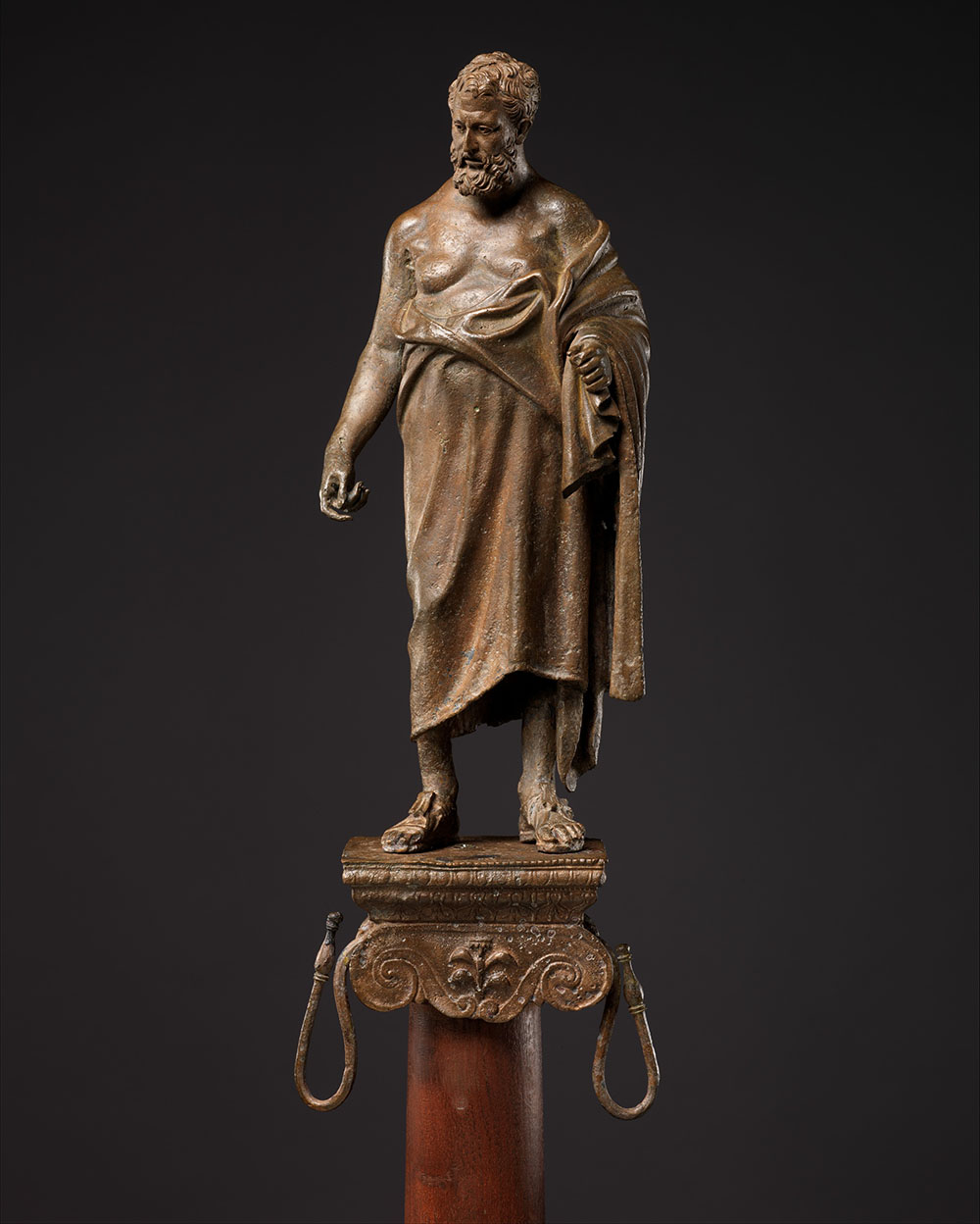 Bronze statuette of a philosopher on a lamp stand, Roman, first century BC.
