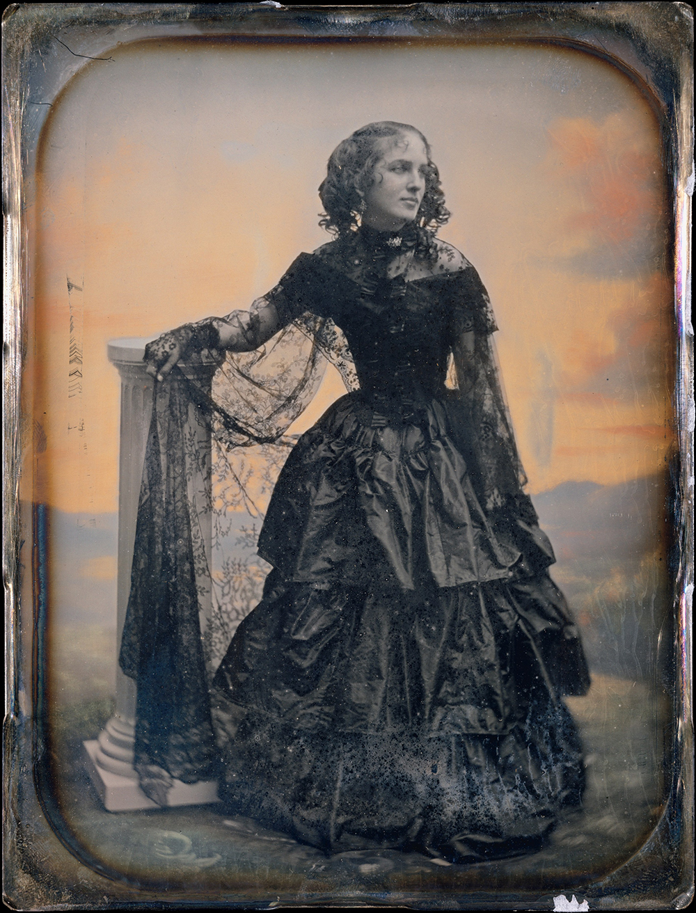 Photograph of woman in black taffeta dress and lace shawl by Southworth and Hawes, c. 1850.