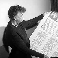 Photograph of Eleanor Roosevelt holding the Universal Declaration of Human Rights
