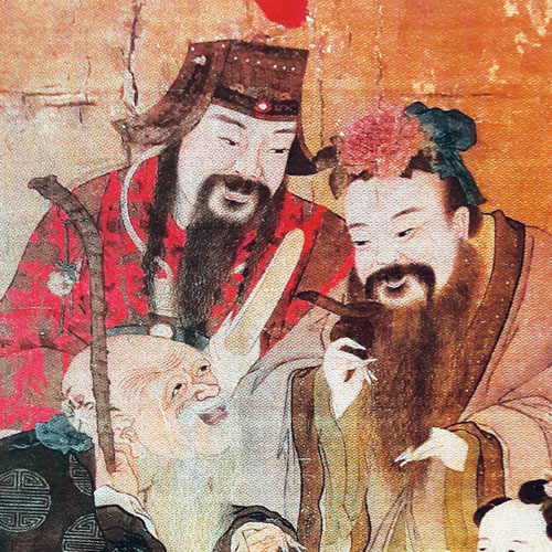 Three men with long beards, smiling together.