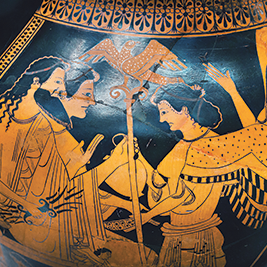 Greek vase depicting two men and a woman