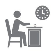 Figure at desk looks at clock above