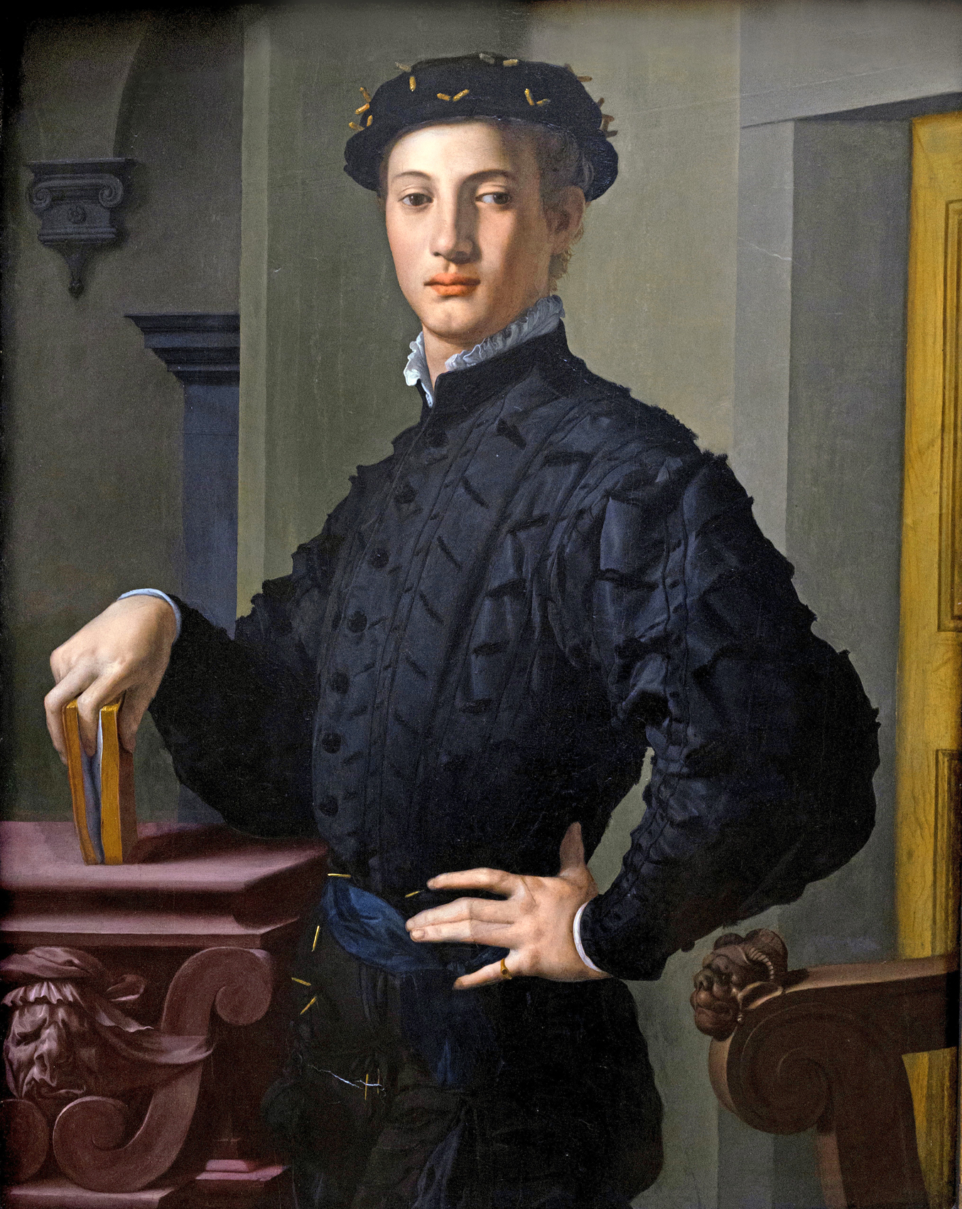 "Portrait of a Young Man" Renaissance painting of a young man holding a book.