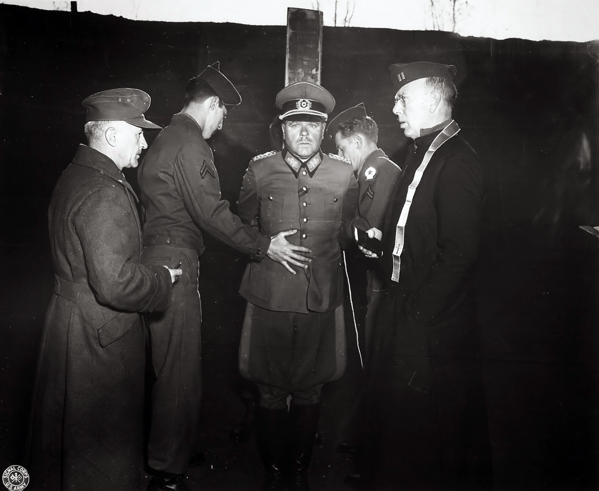 German General Anton Dostler receives last rites before his execution by firing squad. He was convicted and sentenced to death by an American military tribunal in Aversa, Italy, December 1, 1945. The U.S. National Archives and Records Administration, Coll