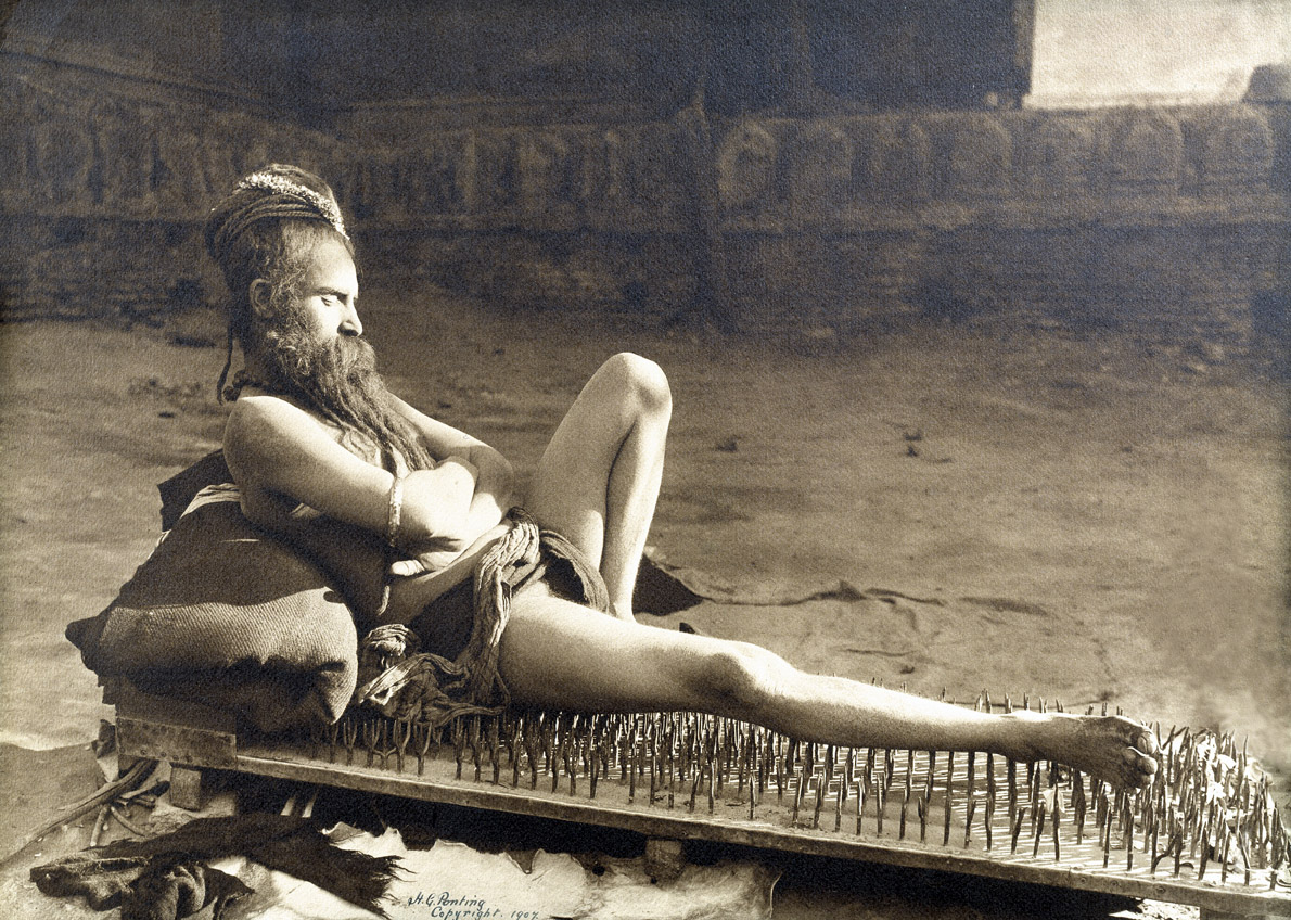 Fakir on a bed of nails, Varanasi, India, 1907. Photograph by Herbert Ponting. 