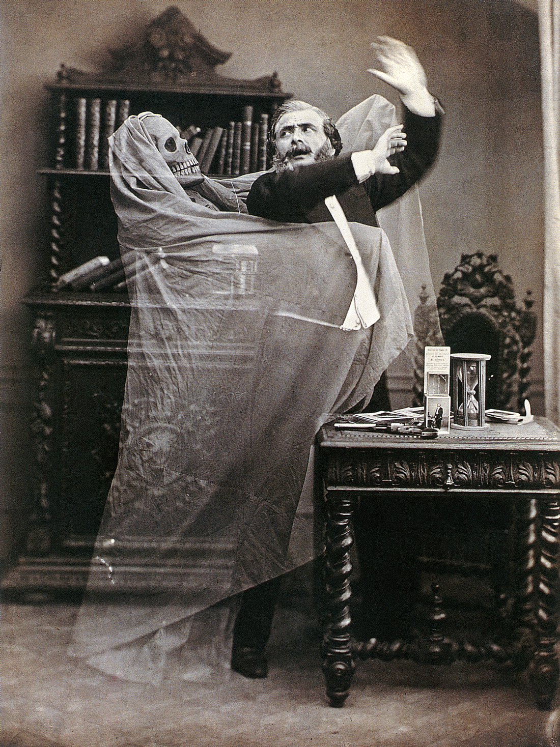 Double-exposed photograph of French illusionist Henri Robin with a ghost, by Eugène Thiébault, 1863. © The Granger Collection, NYC