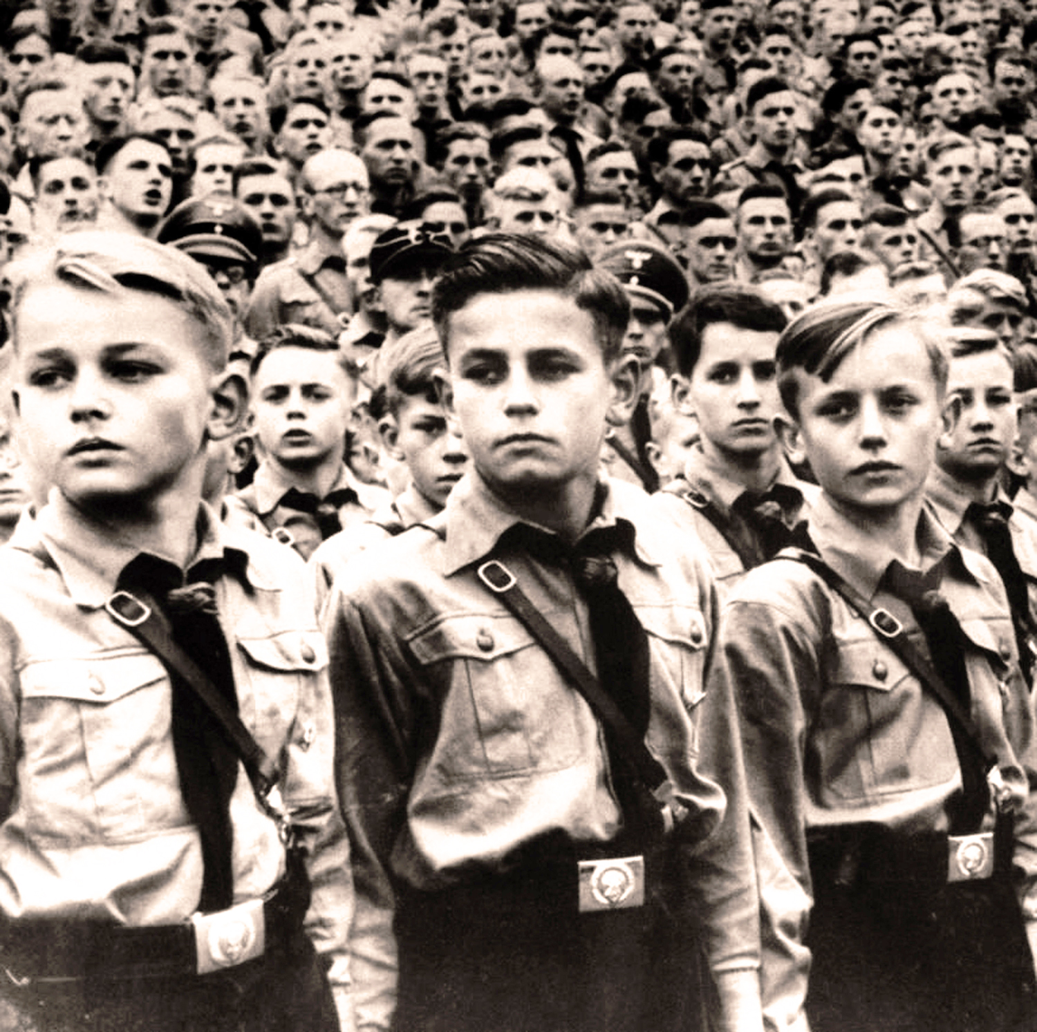 Hitler Youth parade, c. 1936. Black and white photograph of young boys at a Hitler Youth rally.