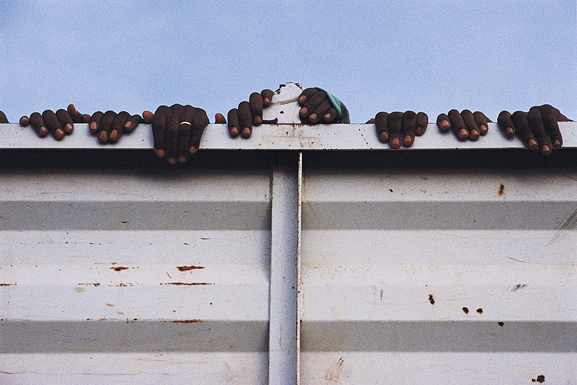 Prisoners Trucked to Gacaca Hearing, from the series Rwanda: After, by Michael Ronnen Safdie, 2003.