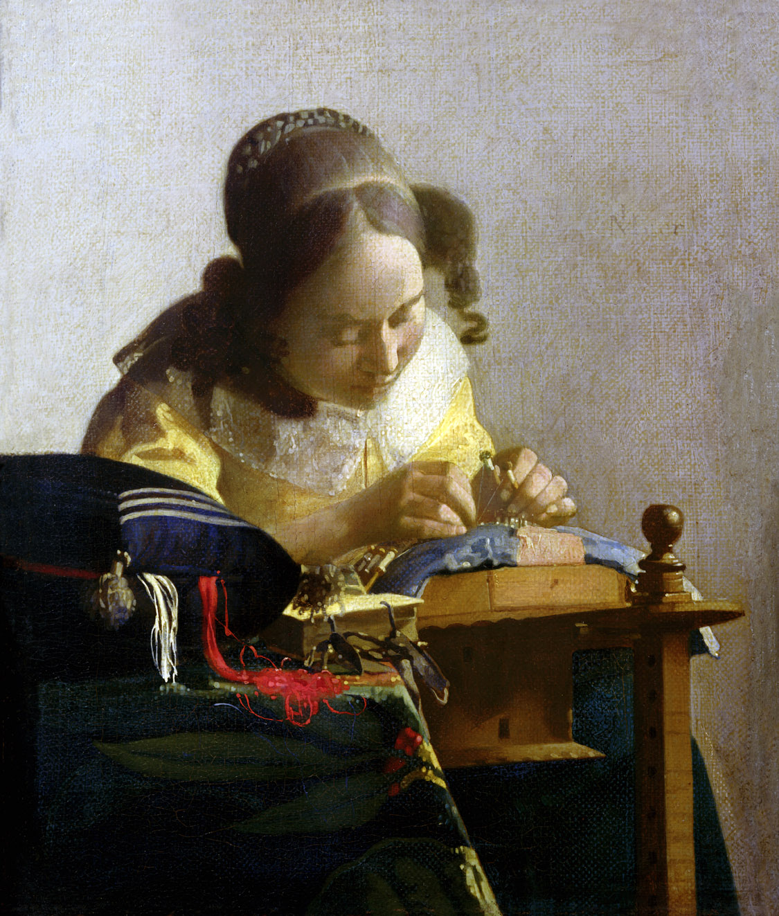 The Lacemaker, by Jan Vermeer, c. 1669. Louvre Museum, Paris.