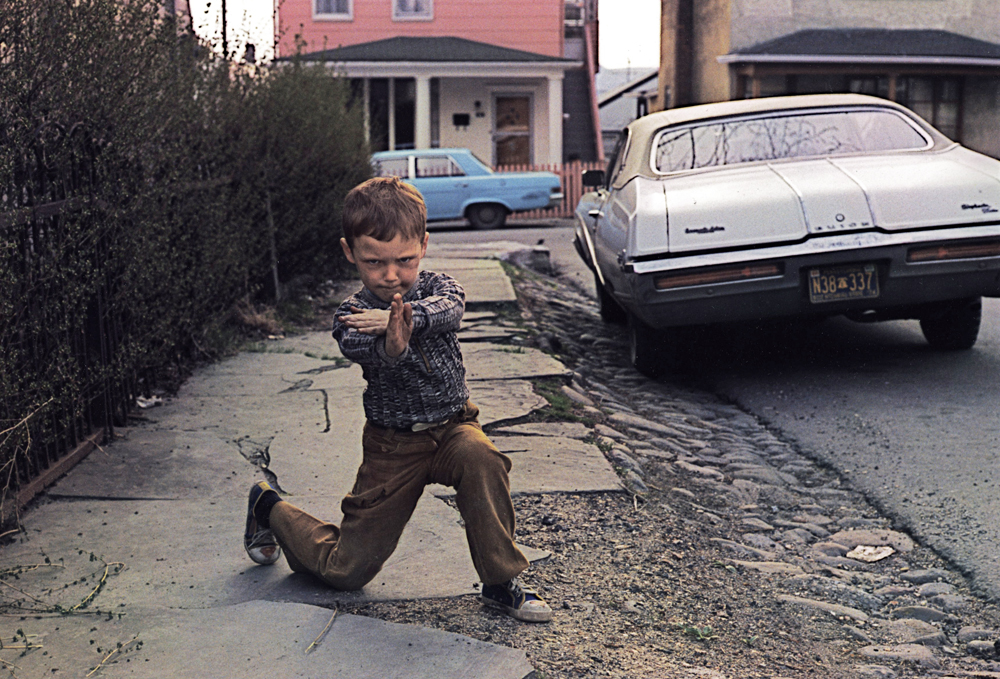 1977 color photograph of a young boy in a karate pose.