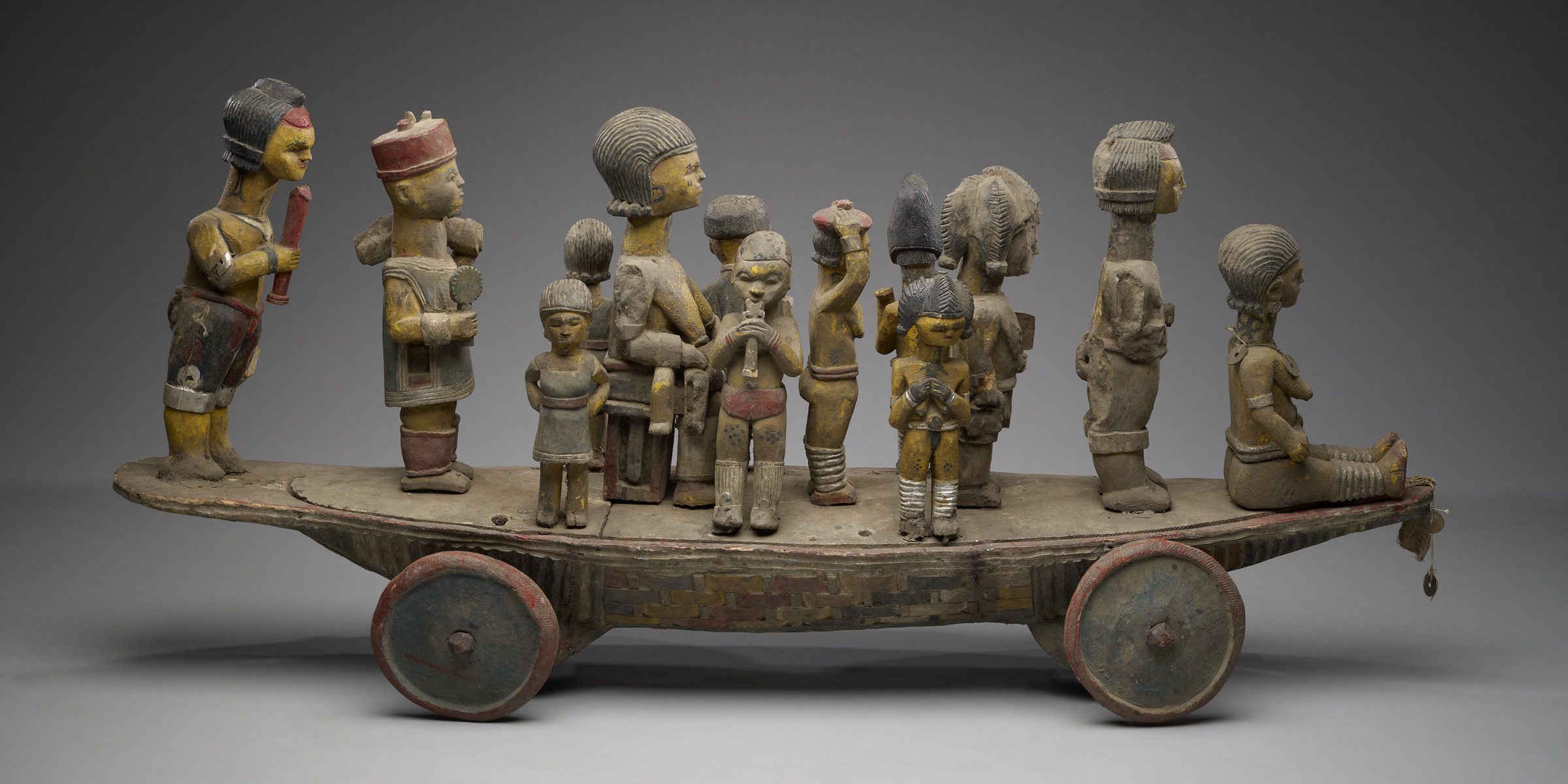 Boat on wheels supporting a queen and her entourage, Nigeria, twentieth century.