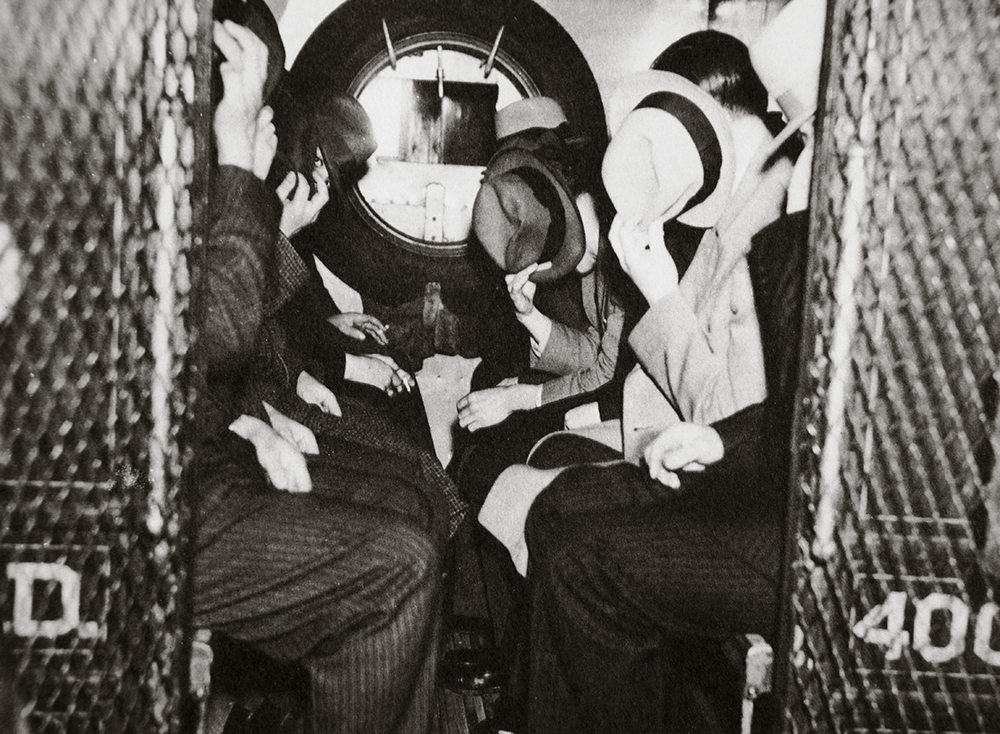 Gangsters in a patrol wagon, New York, c. 1935.