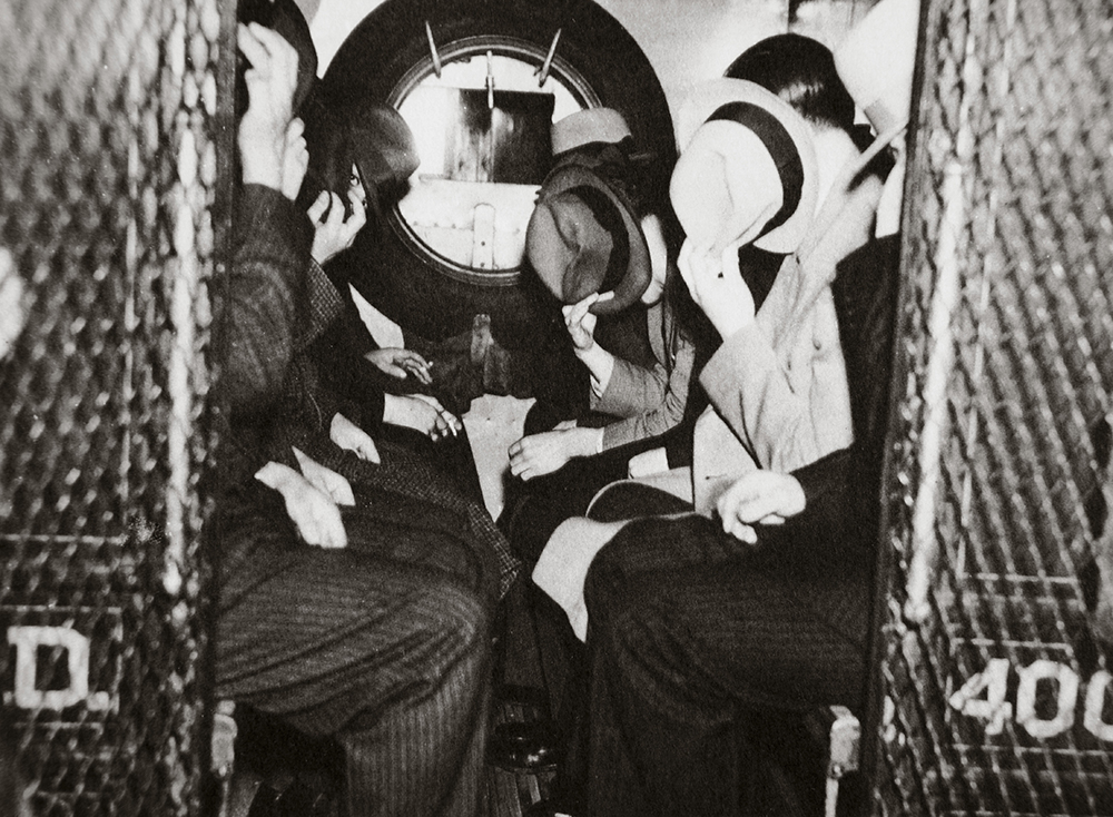 Gangsters in a patrol wagon, New York, c. 1935. © HIP / Art Resource, NY. Gangsters in a patrol wagon, New York, c. 1935.