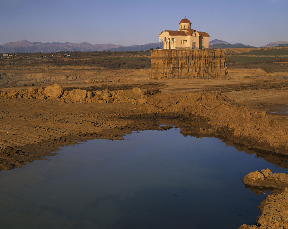 Church in the strip-mined village of Anthochori, Greece, 2007. Photograph by Stuart Franklin. © Stuart Franklin / Magnum Photos.