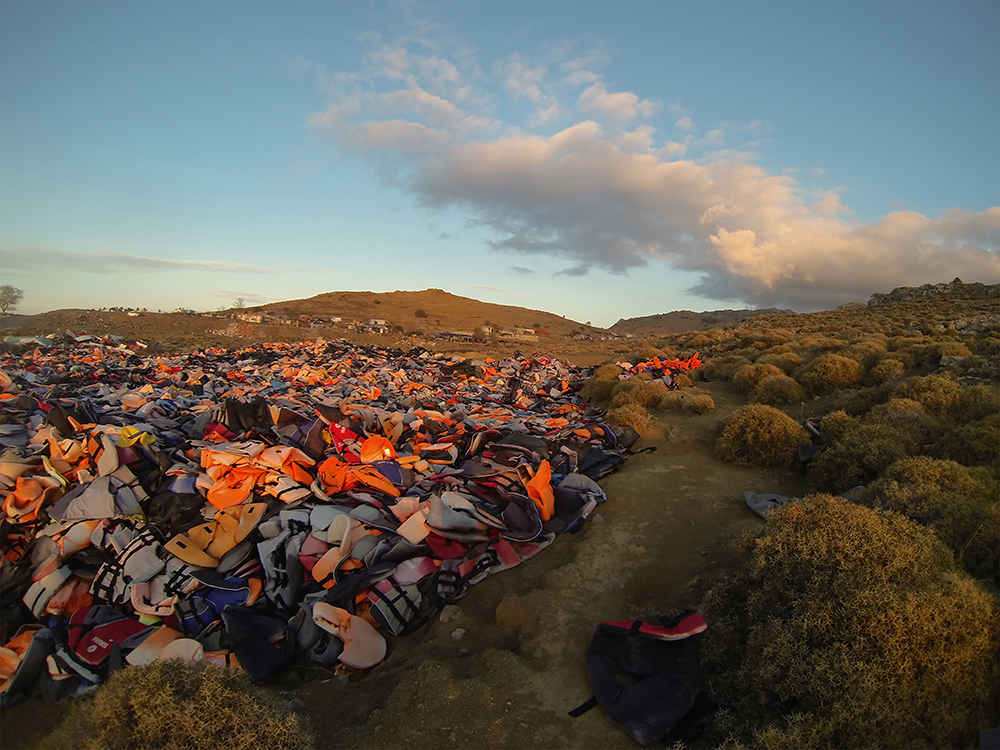 Division Line, by Pam Longobardi, 2016. Archival pigment print, 27 x 40 inches. Site photograph of the “life-jacket graveyard,” Lesbos, Greece. © Pam Longobardi, courtesy the artist and HATHAWAY | Contemporary Gallery, Atlanta. Division Line, by Pam Longobardi, 2016. Archival pigment print, 27 x 40 inches. Site photograph of the “life-jacket graveyard,” Lesbos, Greece. © Pam Longobardi, courtesy the artist and HATHAWAY | Contemporary Gallery, Atlanta.