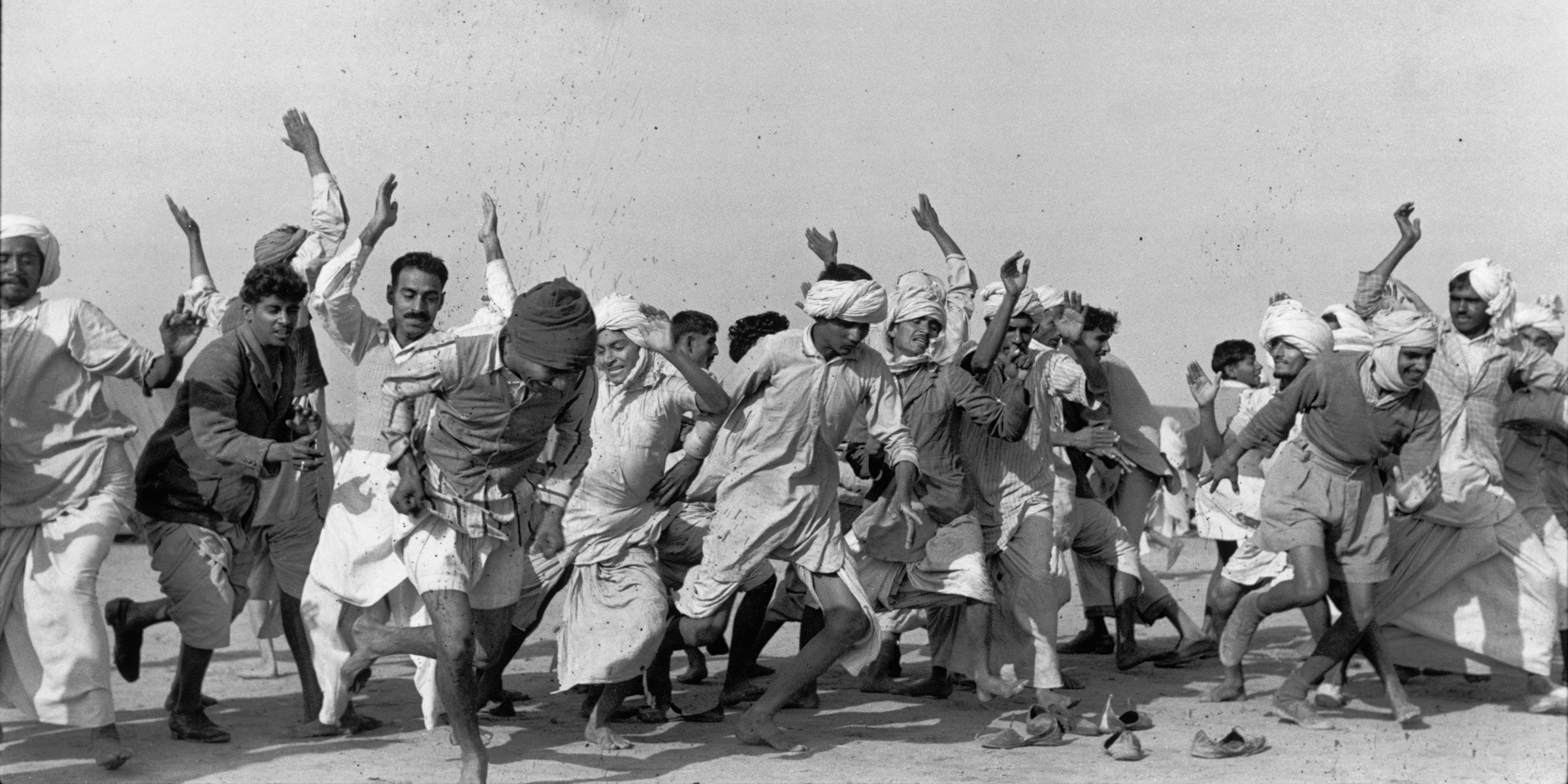 Refugees exercising to drive away lethargy and despair, Kurukshetra, India, 1947. Photograph by Henri Cartier-Bresson. © Henri Cartier-Bresson / Magnum Photos.