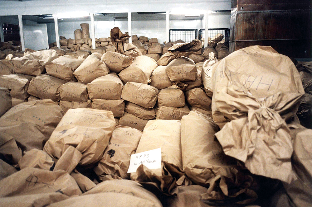 Sacks full of Stasi files in the former Ministry for State Security headquarters, Berlin, 1996. © SZ Photo / Joker / David Ausserhofer / Bridgeman Images.