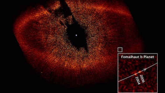 A telescopic image of the formalhault solar system. A bright dot is surrounded by a cloud of smaller red dots. An inset shows a close-up of what looks like a planet, labeled Formalhault b.