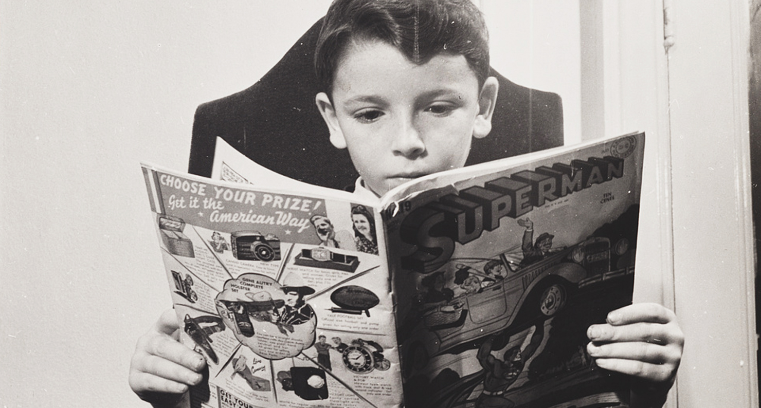 A German refugee child reads a Superman comic, 1942