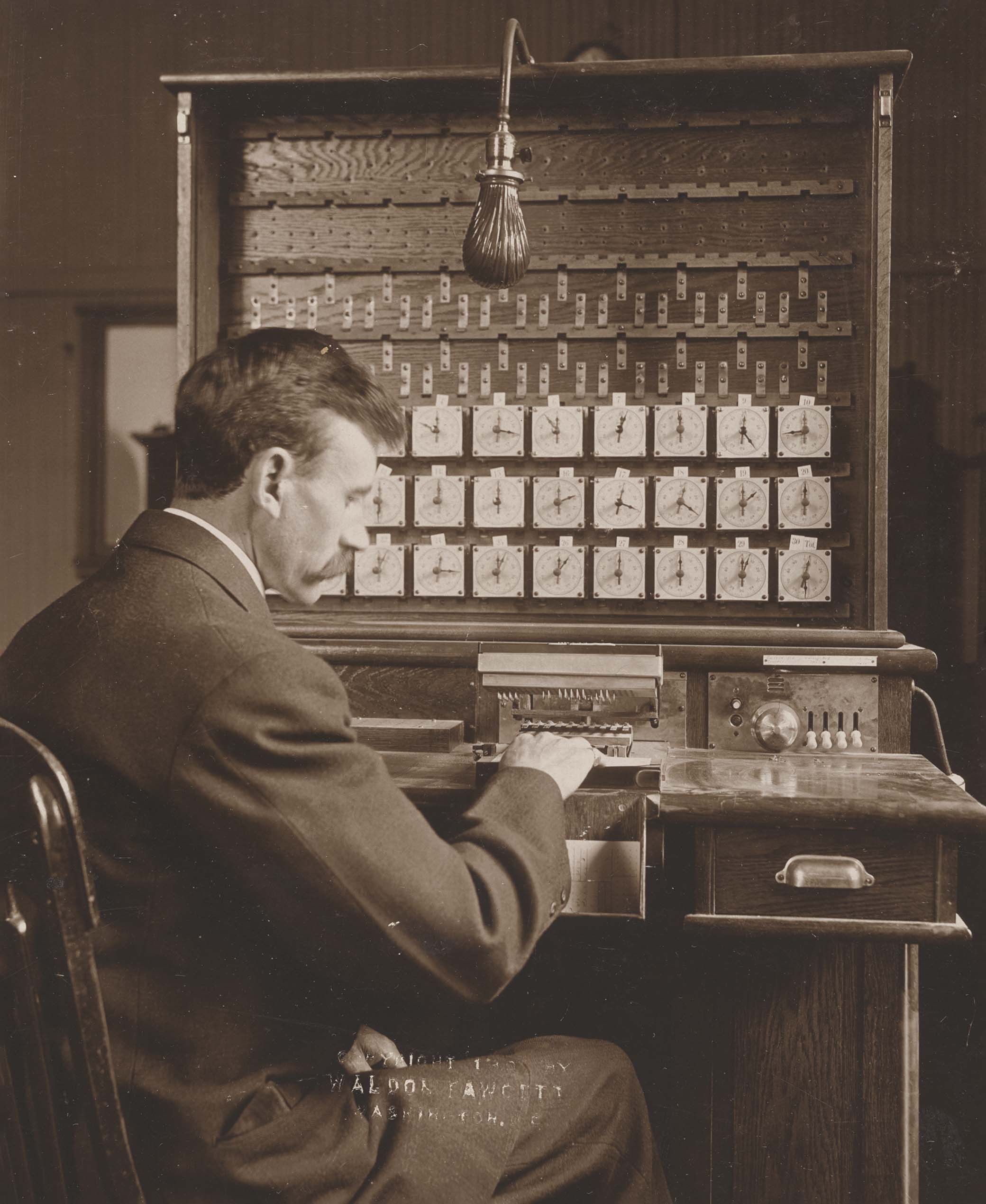 U.S. Census Bureau staff using Hollerith electrical tabulator, 1908. Photograph by Waldon Fawcett.