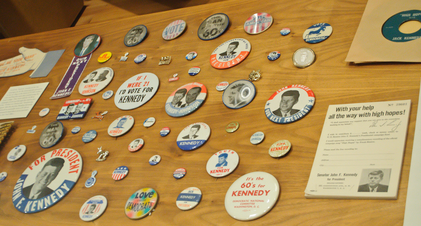 Some campaign buttons for the 1960 presidential election, pitting Senator John F. Kennedy against Vice President Richard Nixon, on display. John F. Kennedy Presidential Library, University of Massachusetts Boston.