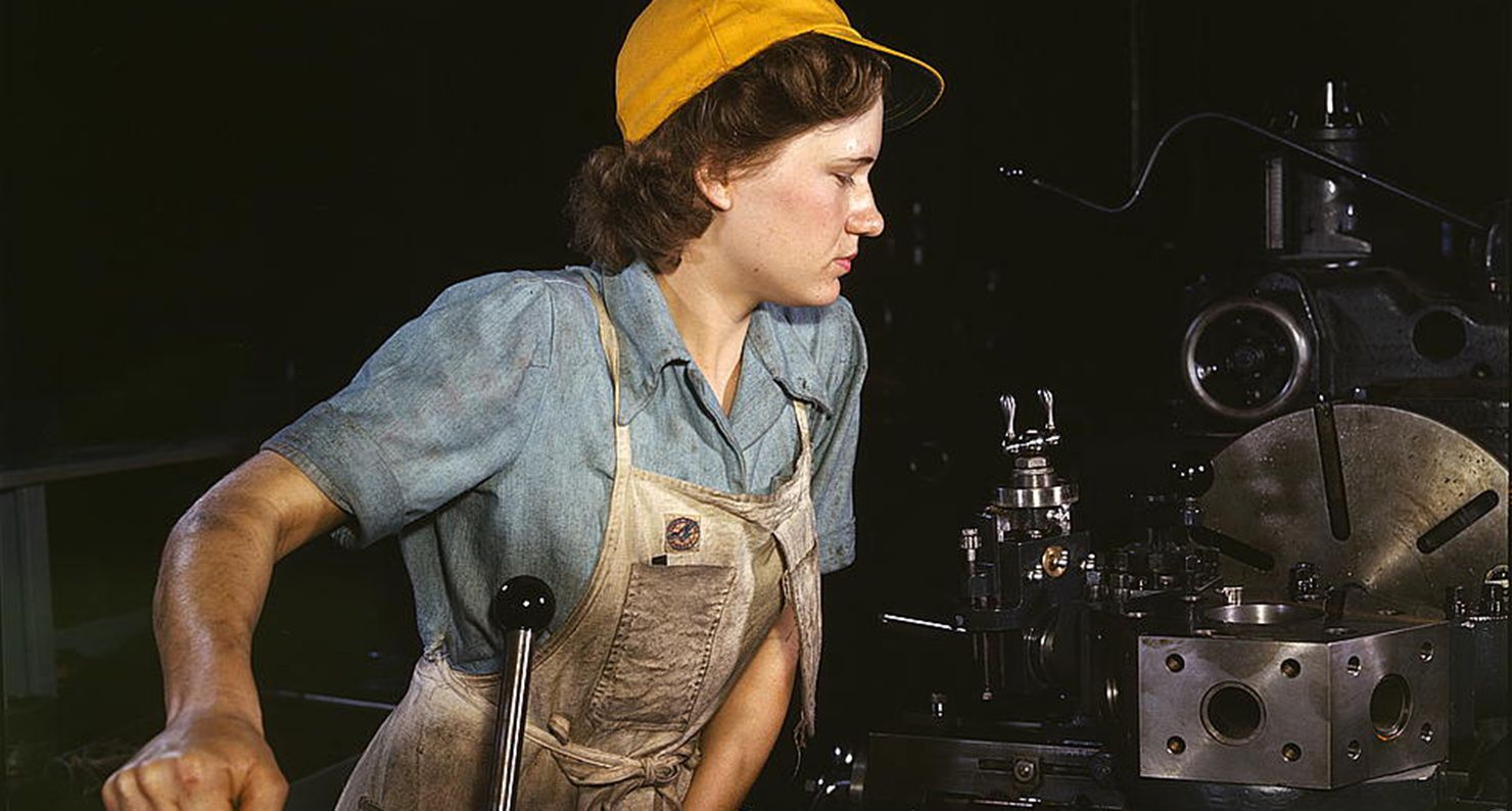 Lathe operator machining parts for transport planes at the Consolidated Aircraft Corporation plant, Fort Worth, Texas