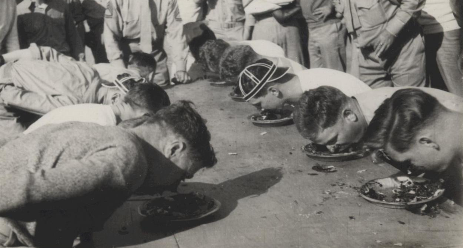 Marines stationed in North China participate in a pie-eating contest, c. 1941. Ray S. Robinson Collection (COLL/1940), U.S. Marine Corps Archives & Special Collections.