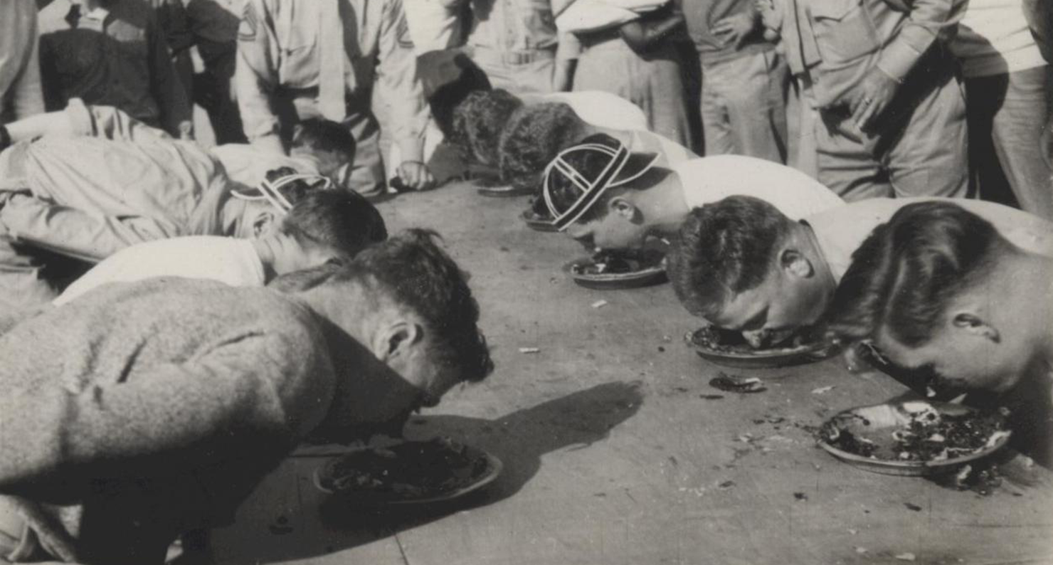 Marines stationed in North China participate in a pie-eating contest, c. 1941. Ray S. Robinson Collection (COLL/1940), U.S. Marine Corps Archives & Special Collections. Marines stationed in North China participate in a pie-eating contest, c. 1941. Ray S. Robinson Collection (COLL/1940), U.S. Marine Corps Archives & Special Collections.