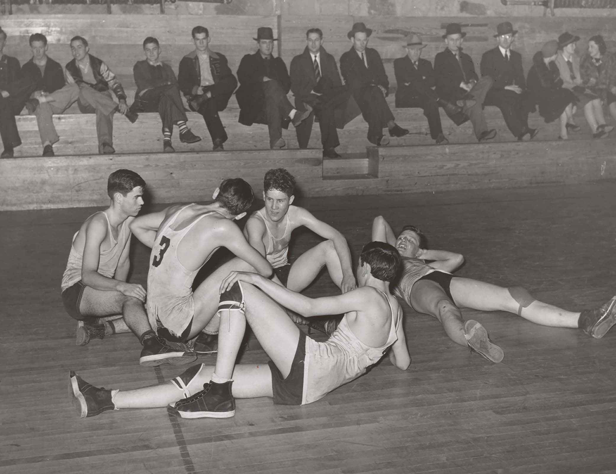 Basketball players resting between periods, Eufaula, Oklahoma, 1940. Basketball players resting between periods, Eufaula, Oklahoma, 1940.