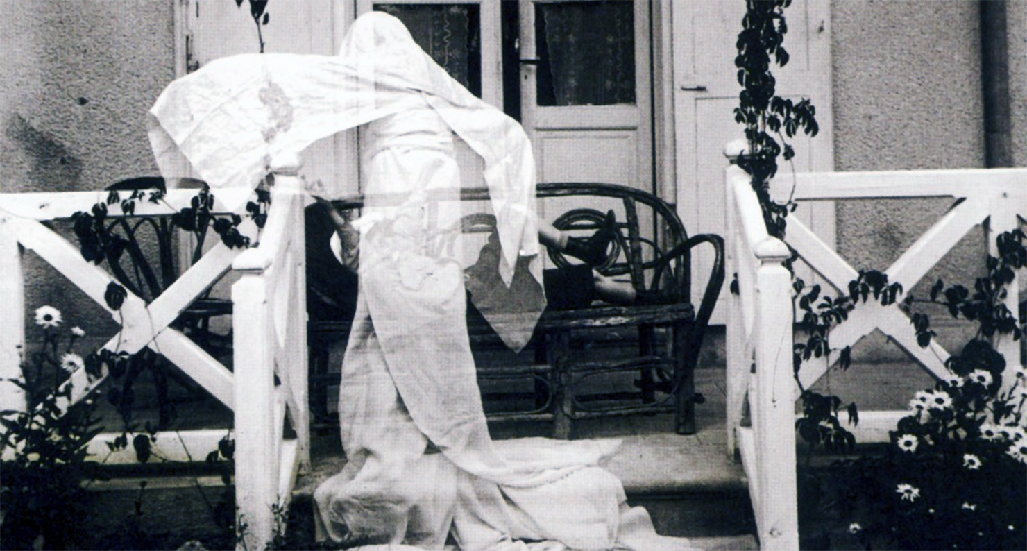 "Zissou as a Ghost, Villa 'Les Marronniers' Chatel-Guyon, July, 1905." Photograph by Jacques Henri Lartigue.