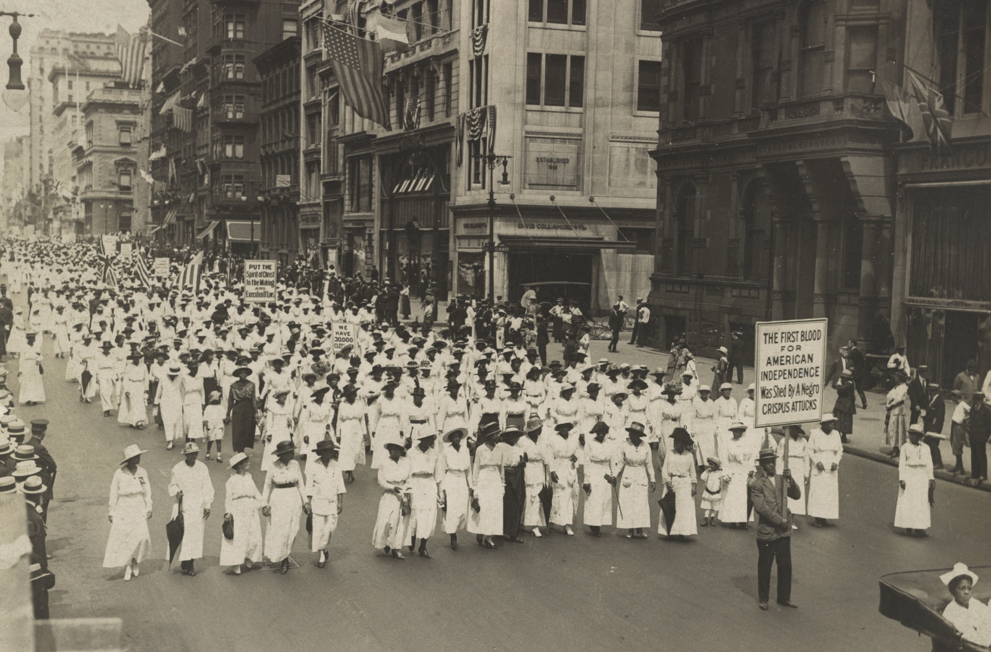 A photograph of a silent march of Black Americans in New York City in 1917, protesting the East St Louis race riots.