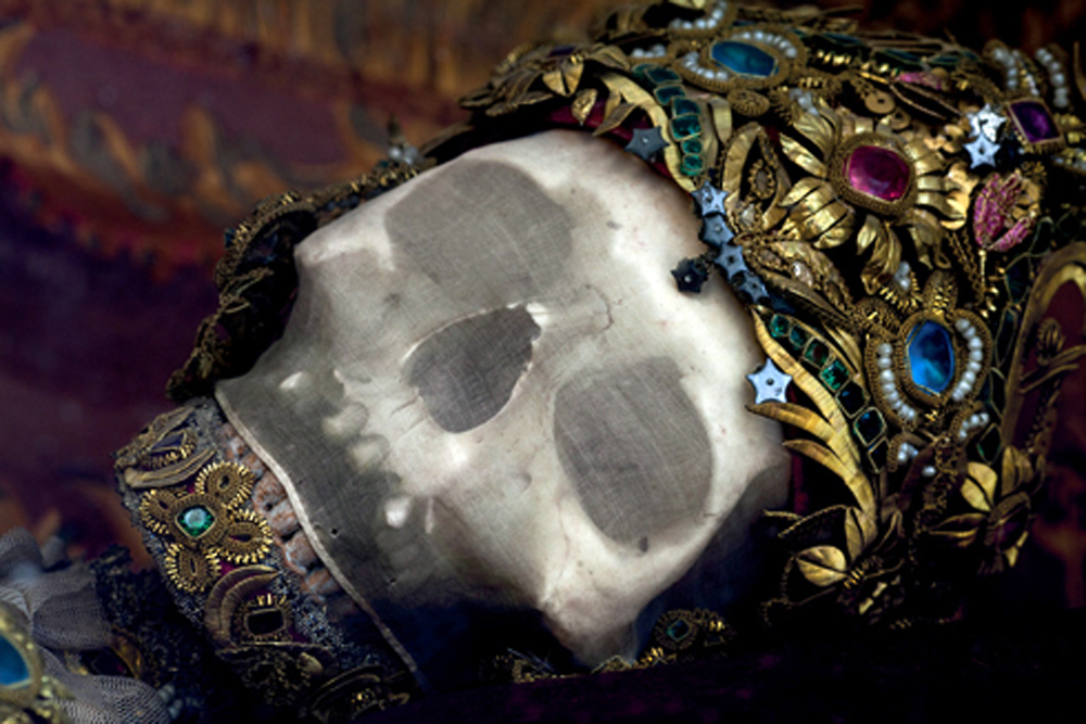Skull of Sain Getreu in Ursberg, Germany, with silk mesh and wire covered in gemstones.