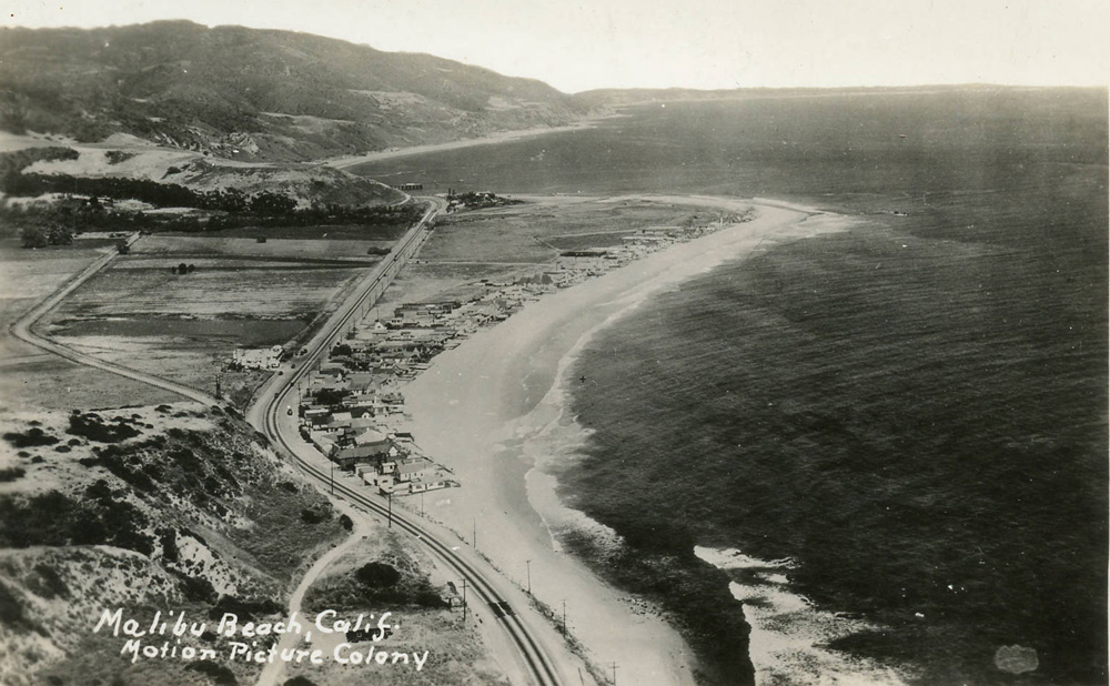 Aerial photograph of the Malibu Movie Colony and the Malibu Pier beyond, 1930s.