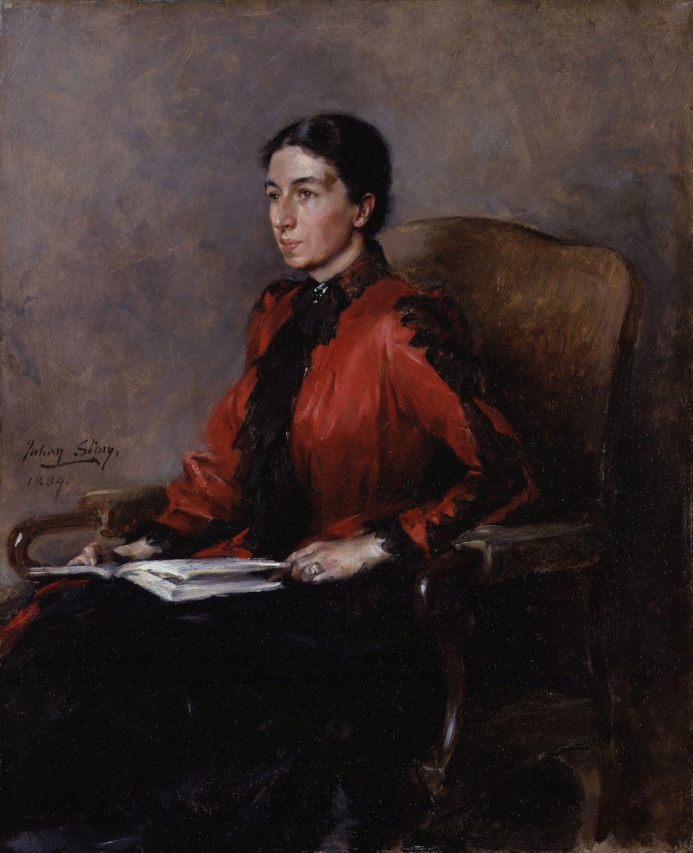 A portrait of Mary Augusta Ward seated, wearing a red dress and holding a book.