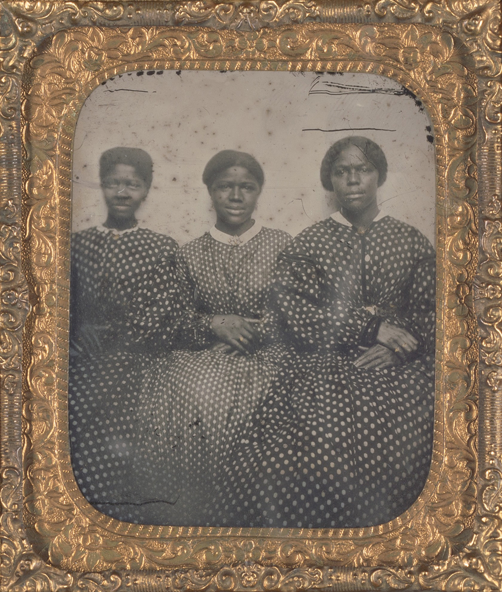 Ambrotype of three women in dotted calico dresses, c. 1850.