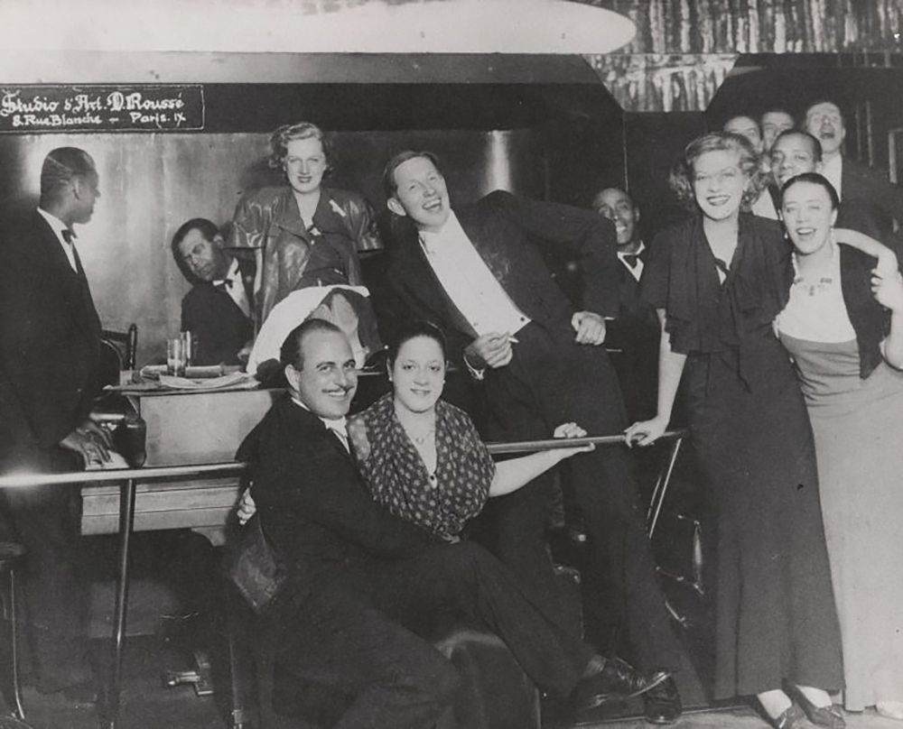 Ada Bricktop’s Rue Pagalle, Paris, 1932. Louis Bromfield is the man holding a cigarette in the center. Schomburg Center for Research in Black Culture, Photographs and Prints Division.