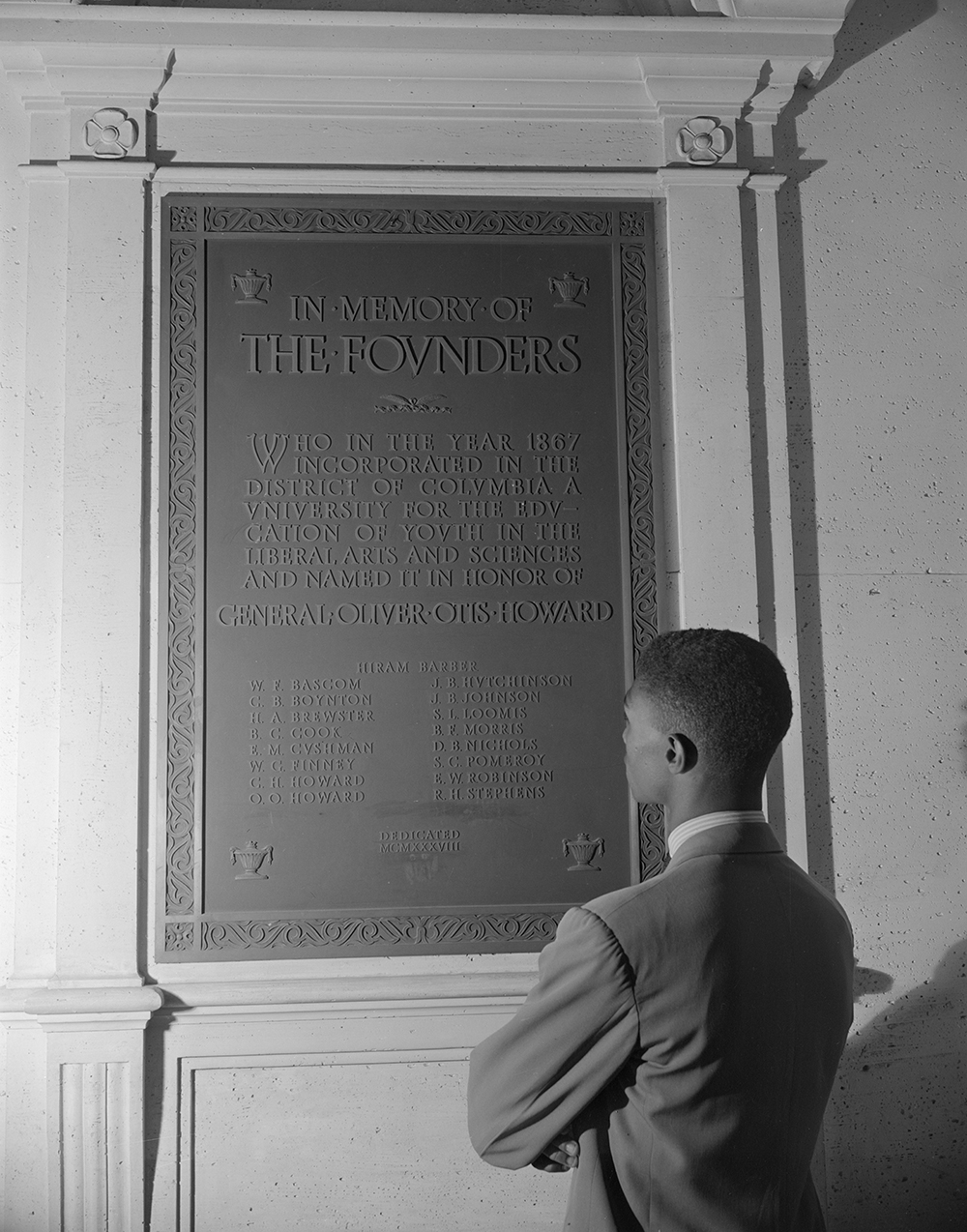 Student reading bronze plaque in the Founders Library, Howard University, Washington, DC, 1942. Photograph by Gordon Parks. Library of Congress, Prints and Photographs Division.